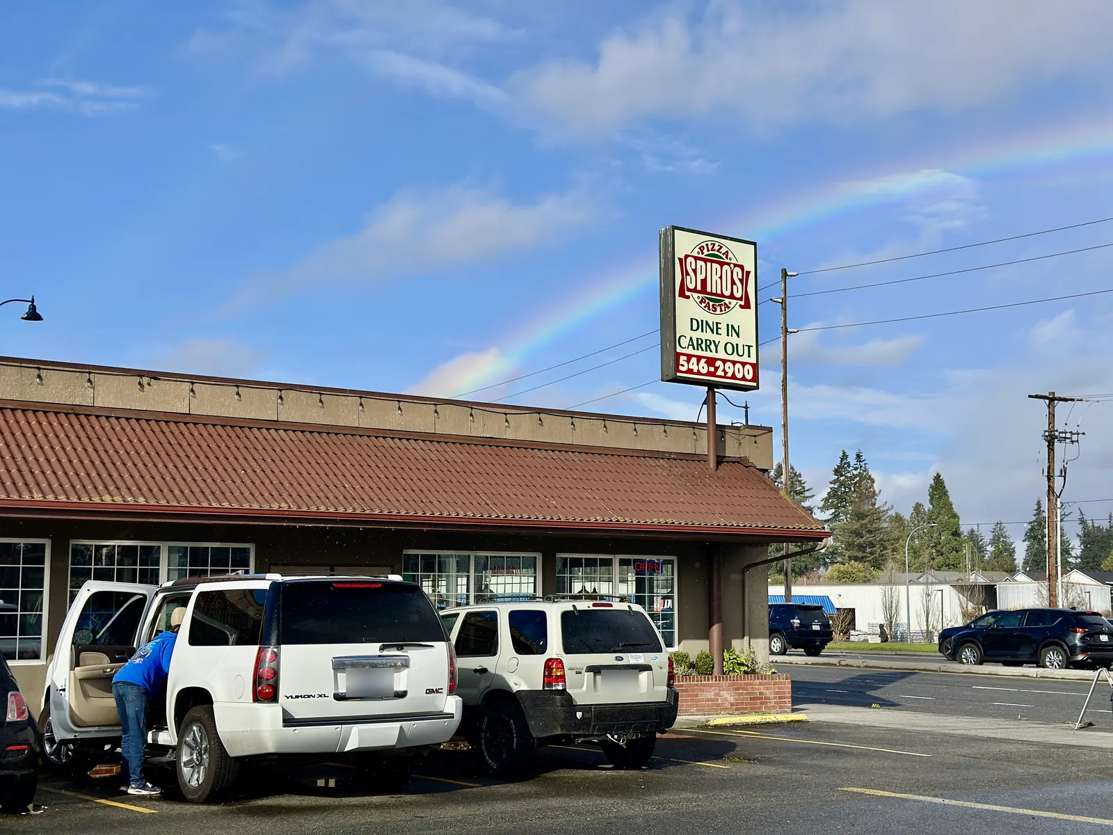 Spiro's Pizza & Pasta on Aurora Avenue in Shoreline, with a rainbow behind the sign